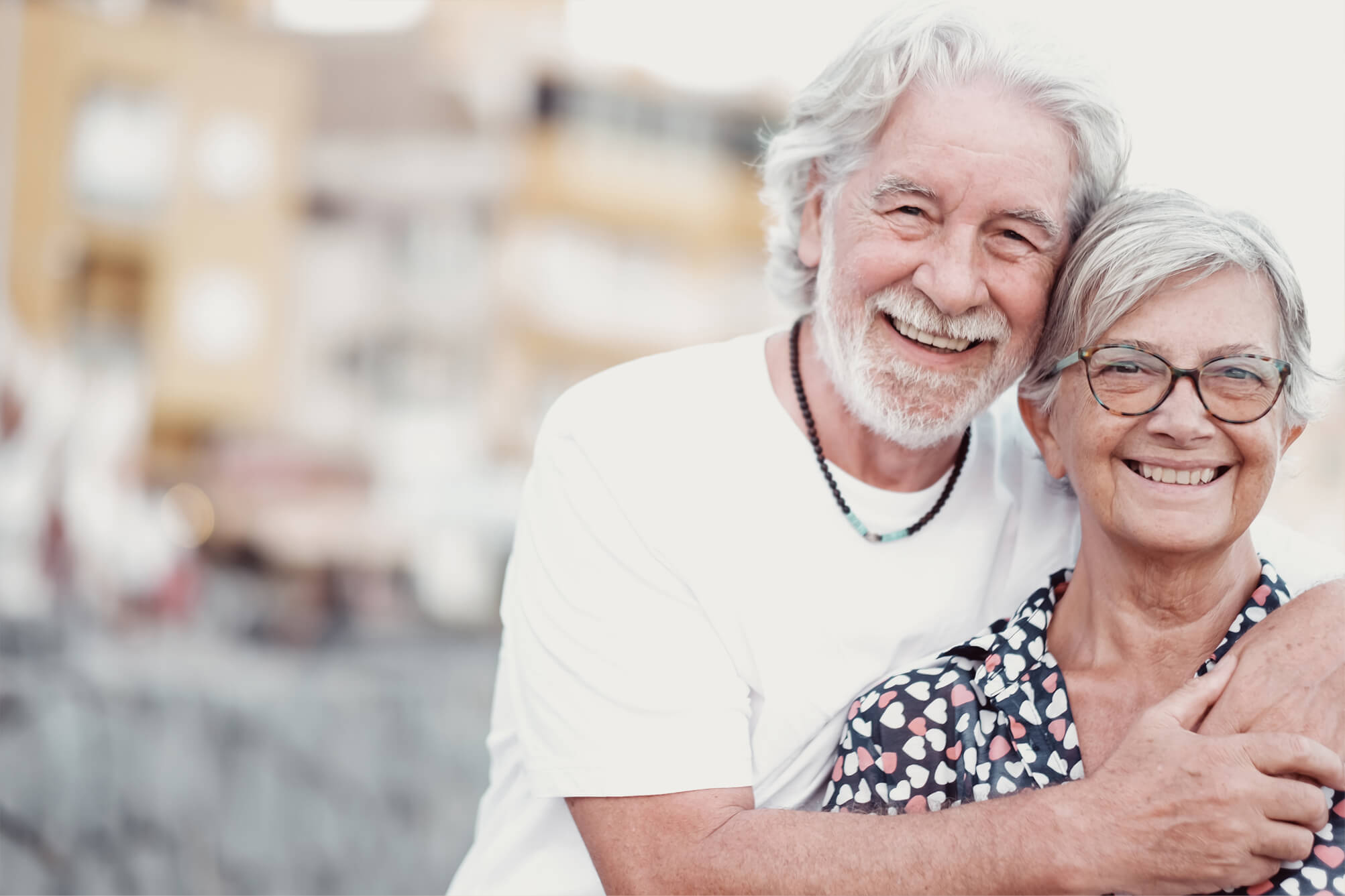 happy-couple-of-grandparents-hug-in-outdoors-smili-2023-11-27-05-08-10-utc